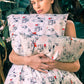 Model holding a silk pillowcase and wearing a mulberry silk headband
