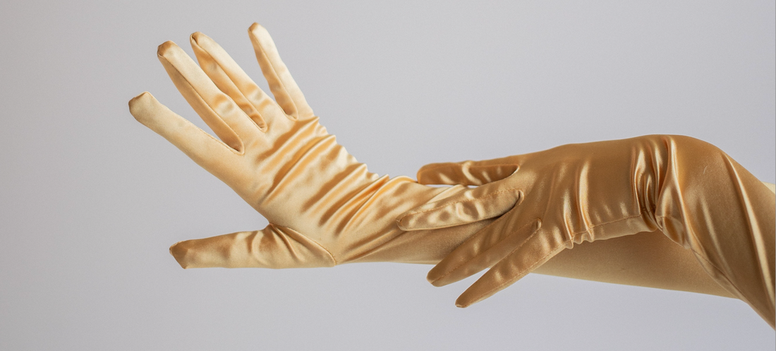 Hands wearing silk gloves