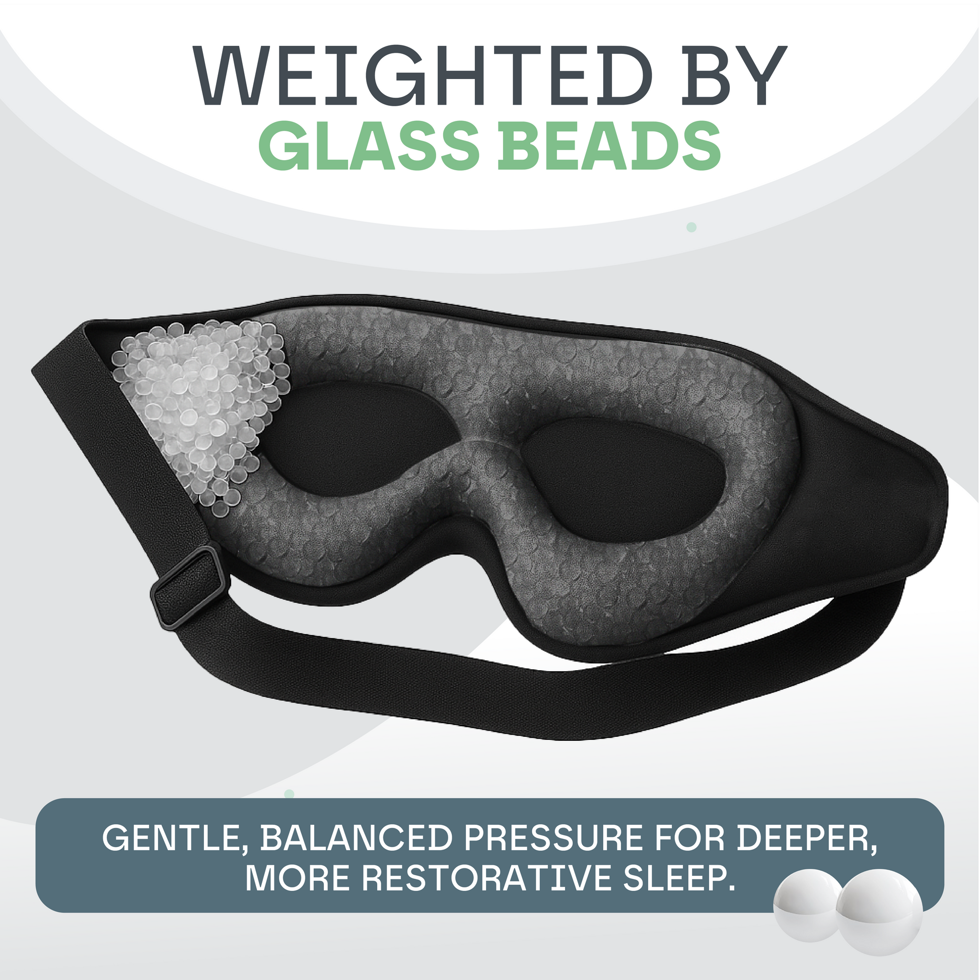 Black sleep mask with glass beads on a light gray background