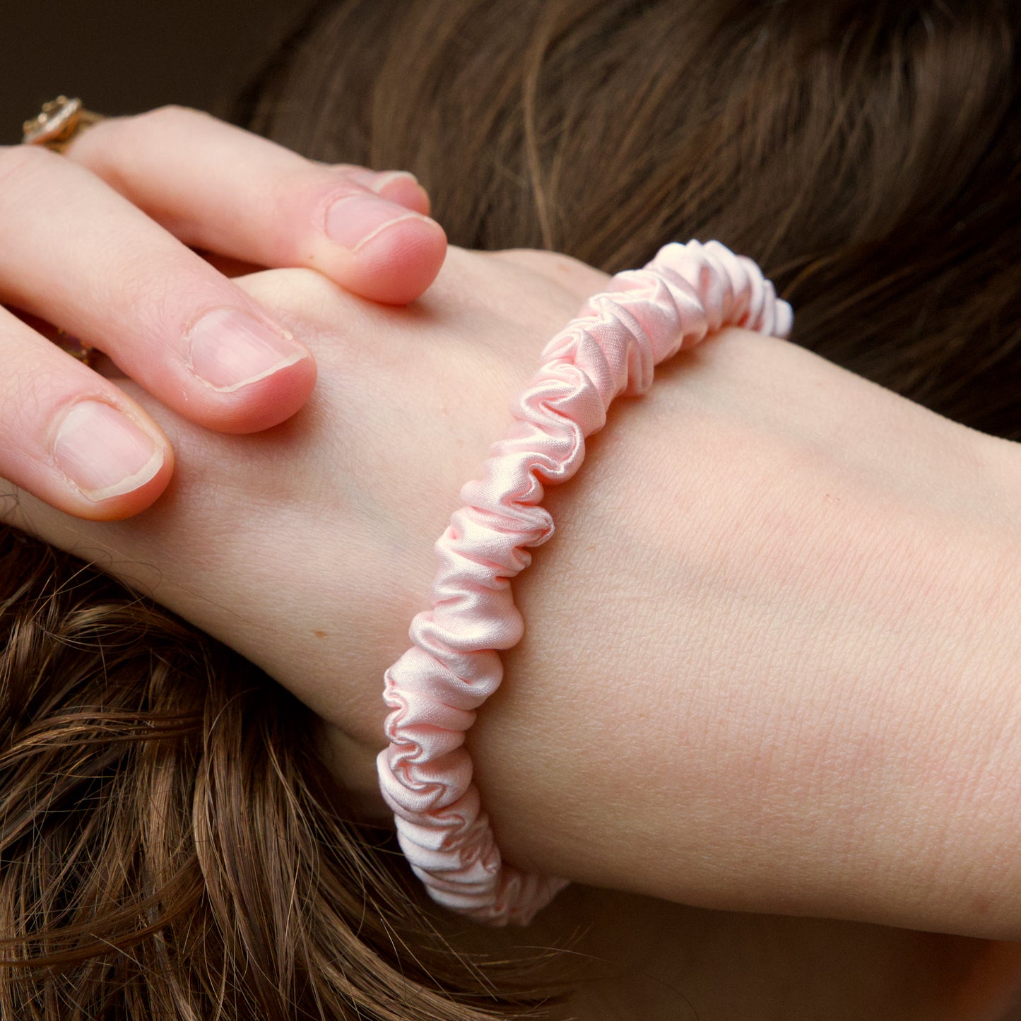 Model wearing a 100% mulberry silk skinny scrunchy