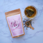 Packet of herbal sleep tea with a cup of tea
