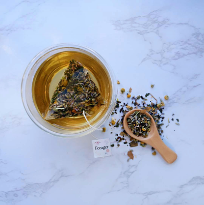 A cup of sleep tea with a herbal tea bag in it