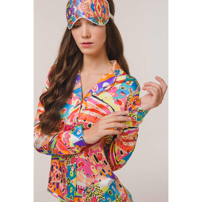 Woman wearing 100% silk pyjamas and eye mask