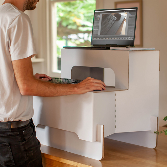 Mojostand Standing Desk Converter with a laptop and keyboard